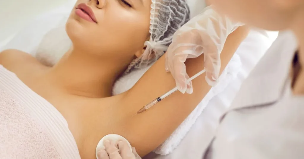 Aesthetic specialist performing injectable sweat reduction treatment under the arm to help control excessive sweating at Contor Studio.